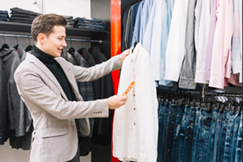 a guy is holding a white shirt